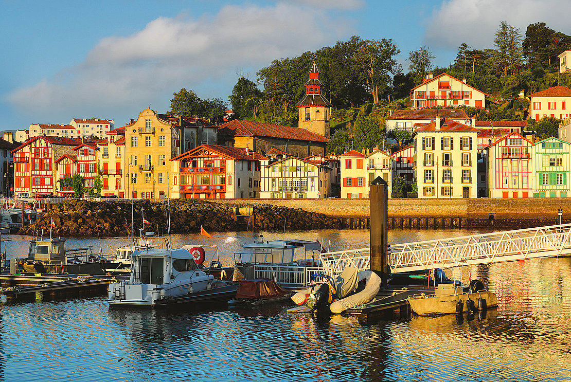 Traditional half-timbered basque houses in port of Saint Jean de Luz, Nouvelle-Aquitaine, France