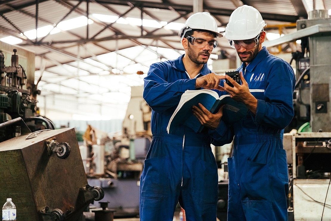 Group of industrial factory maintenance engineers inspect relay