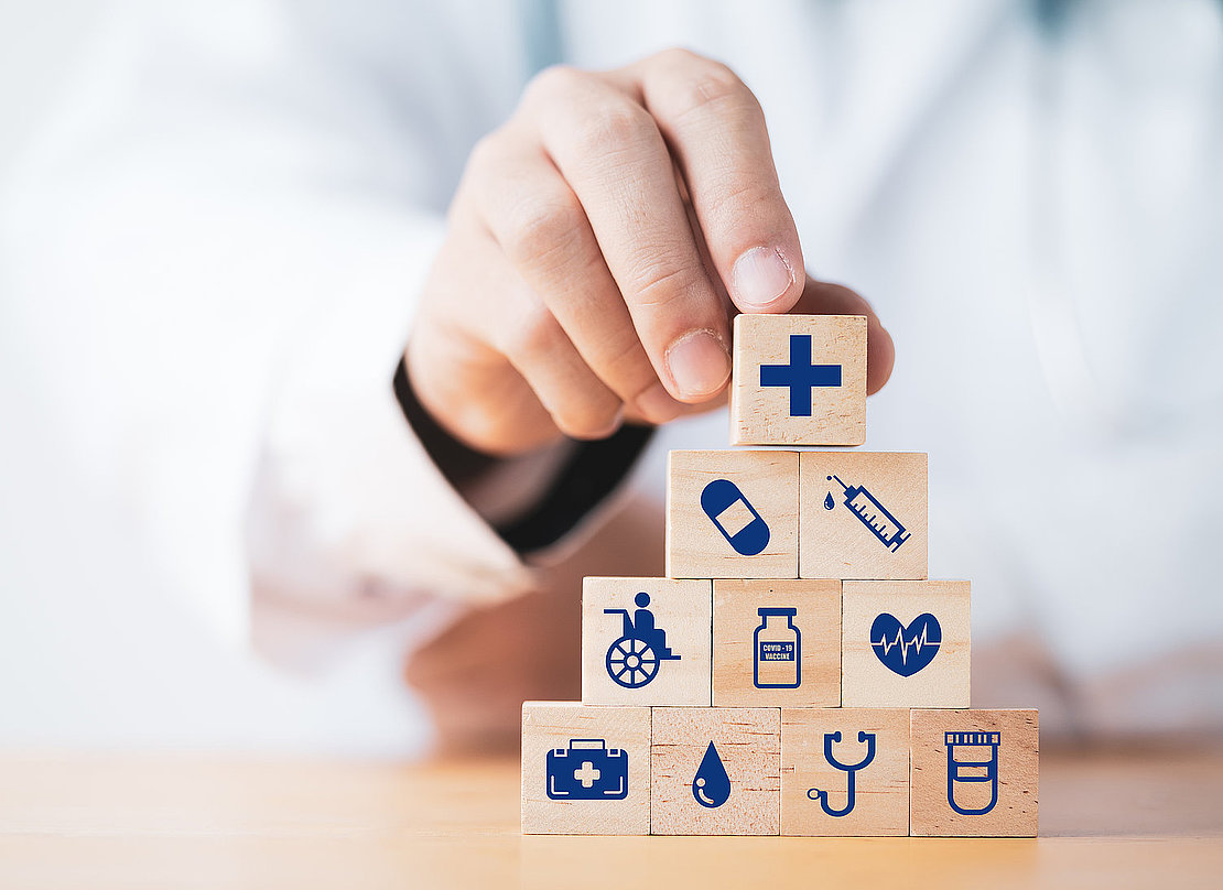 Doctor putting and stacking wooden block cube which print screen