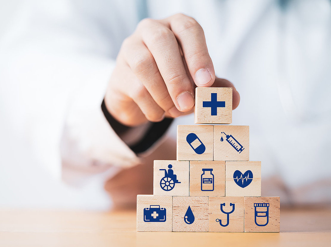 Doctor putting and stacking wooden block cube which print screen