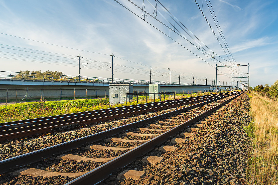 Rail tracks on concrete sleepers and basalt gravel in the Netherlands