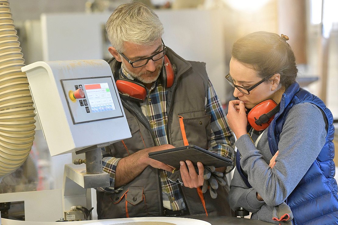 Woman in professional training, wood industrial site