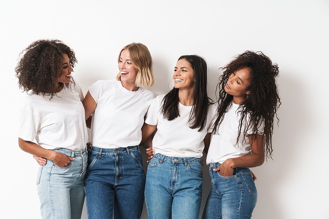 Optimistic cheery young women multiracial friends