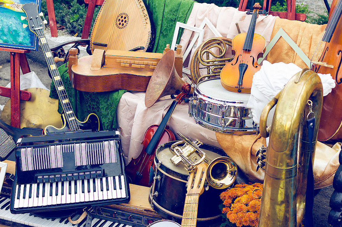 Pile of different old musical instruments